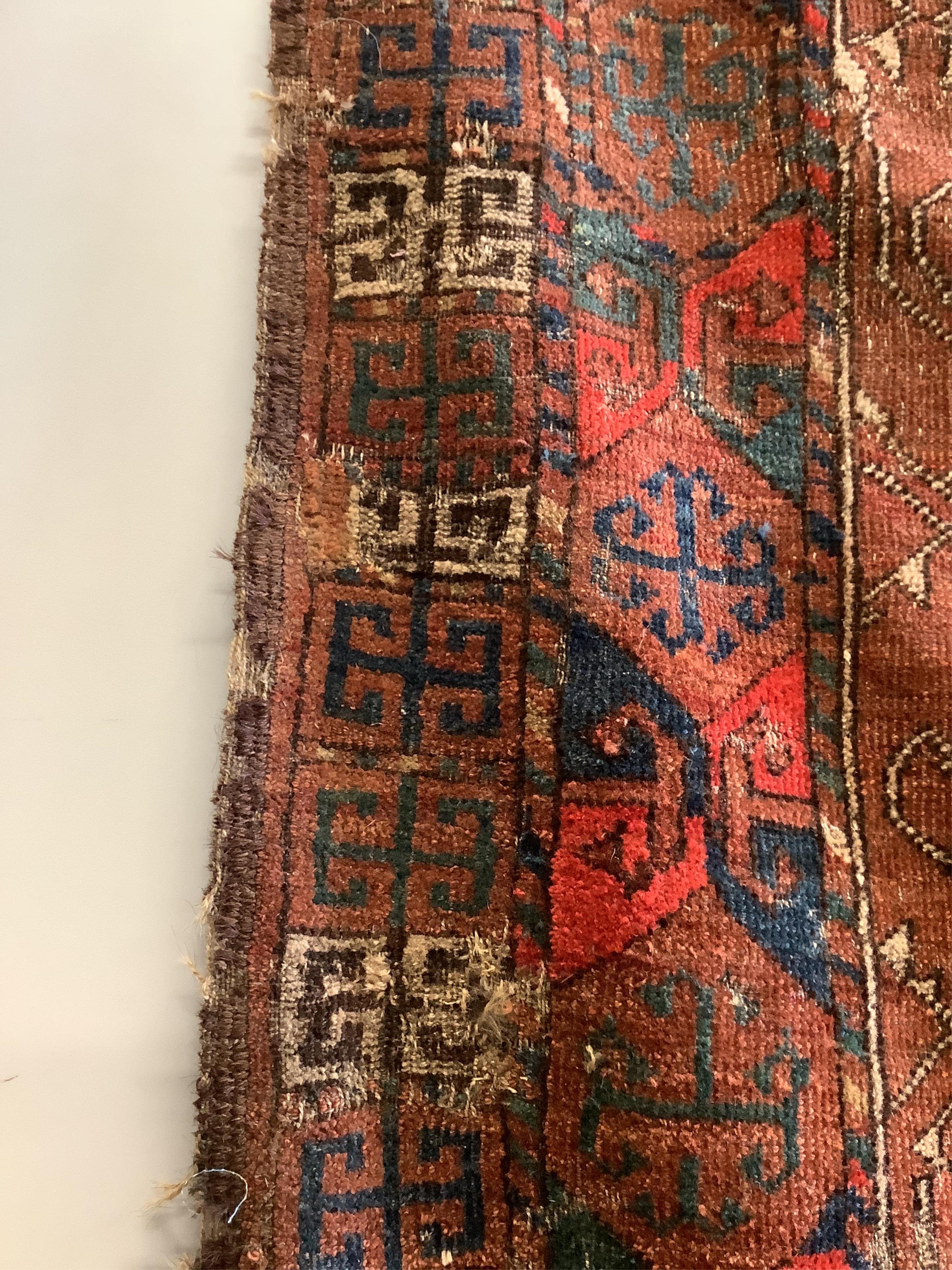 A near pair of antique Turkomen rugs, larger 180 x 134cm. Condition - fair